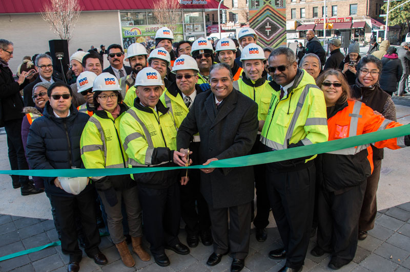 DDC Commisioner Peña-Mora and community members cutting the ribbon at La Plaza de Las Americas