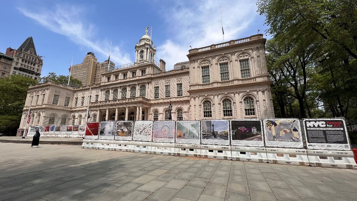 construction fencing featuring more than 40 images of percent for art works outside City Hall