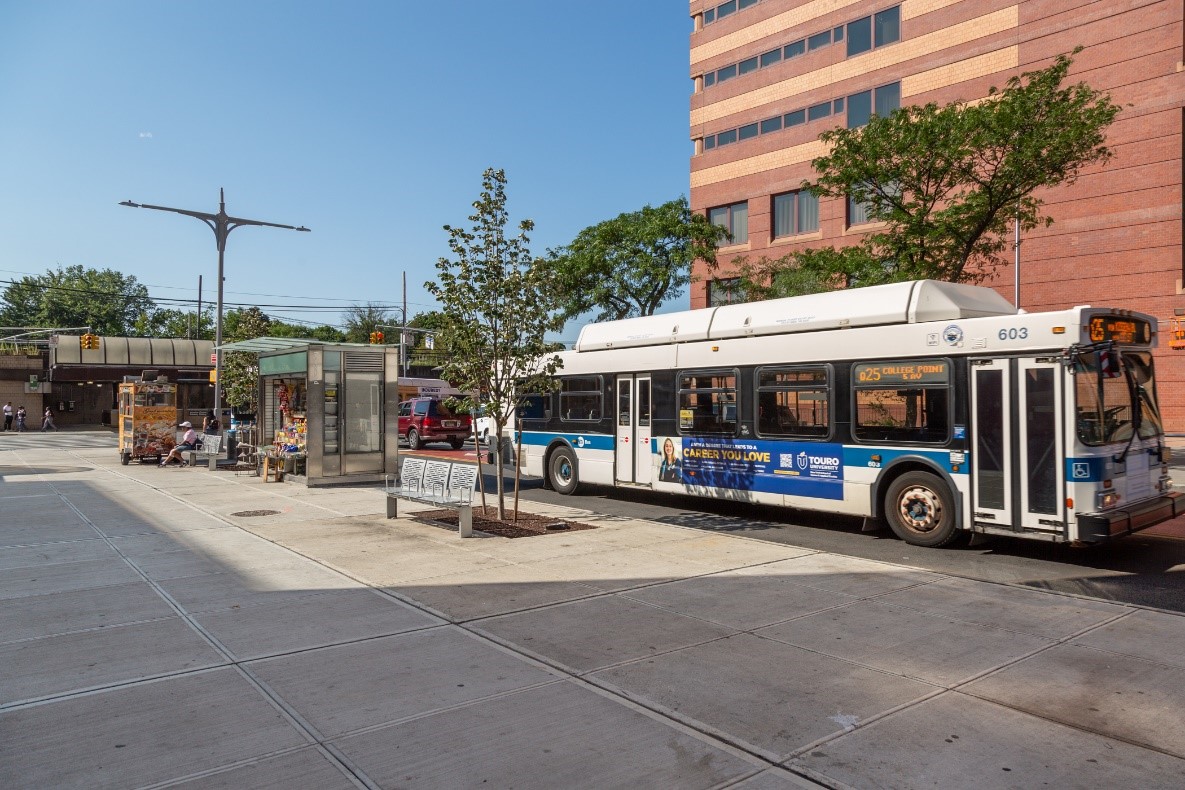 city bus stops at new expanded sidewalk