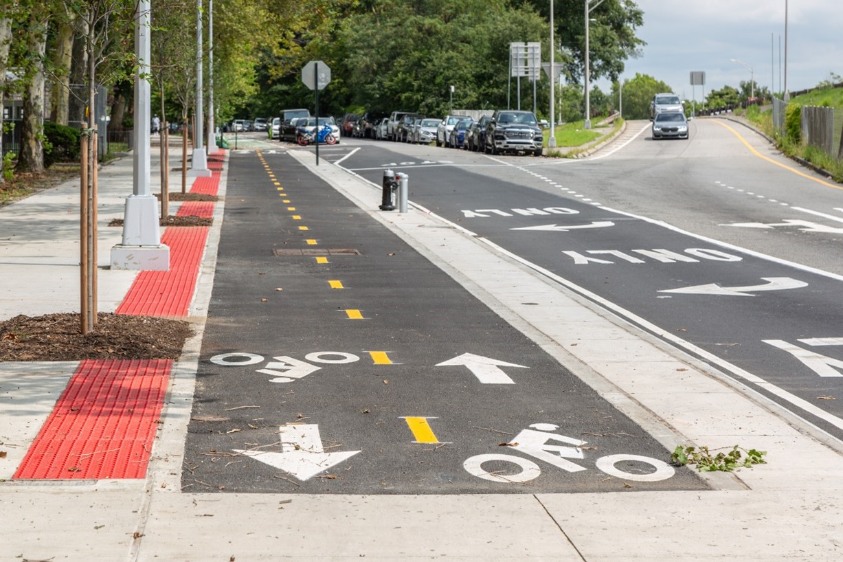 The raised bike lane on a new curb extension