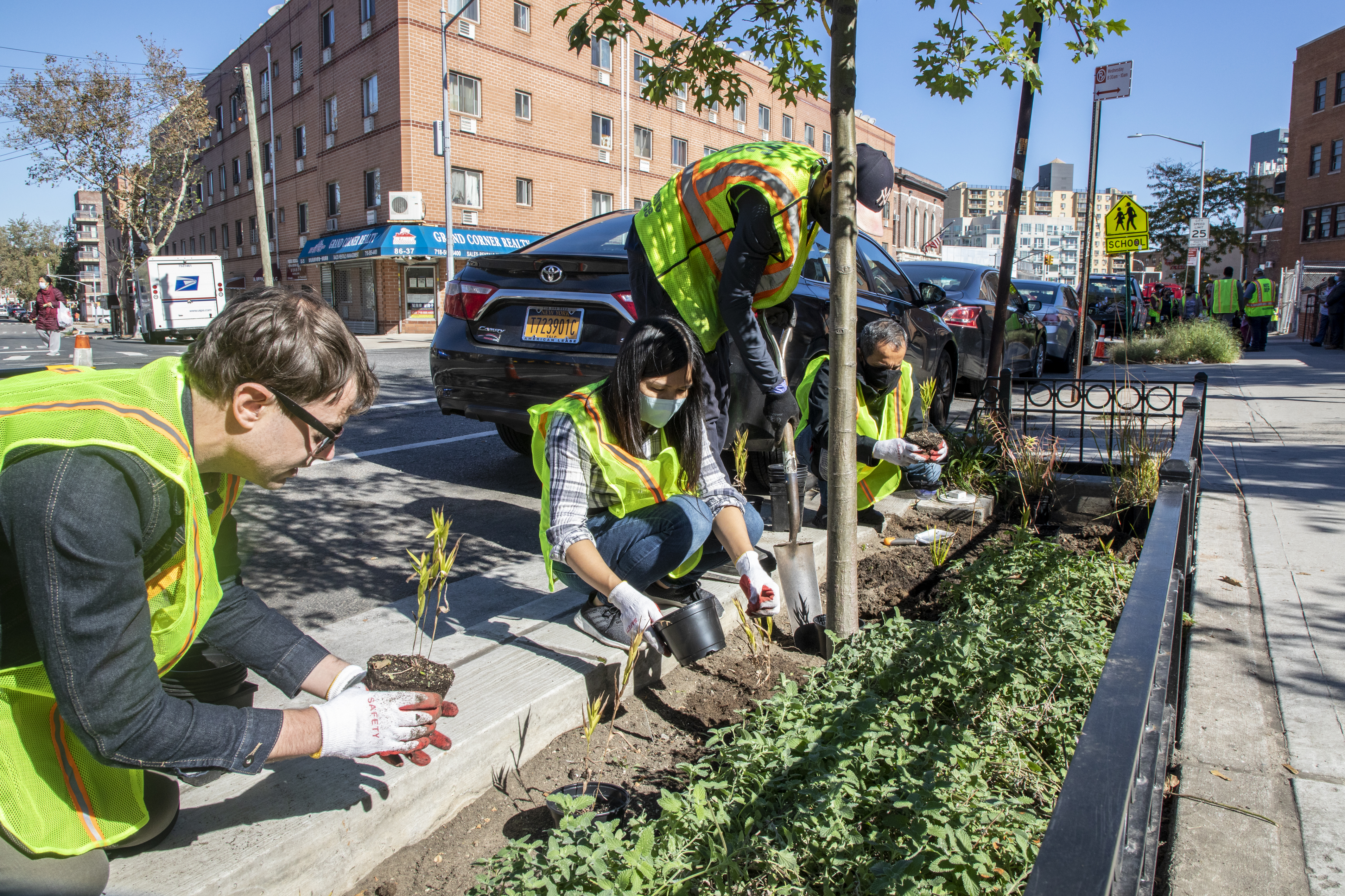 rain garden stewards maintainging a rain garden