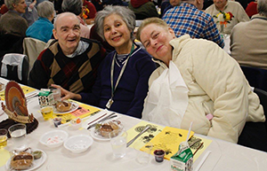 Senior center members enjoy a Thanksgiving Day meal at their center