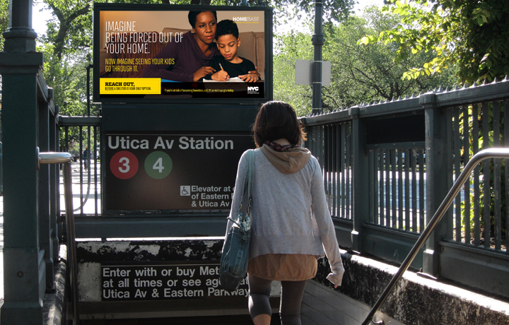 Woman walking down the stairs of a NYC subway station, with a Homebase advertisement above
