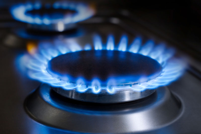 A close-up photo of gas burners on a stove