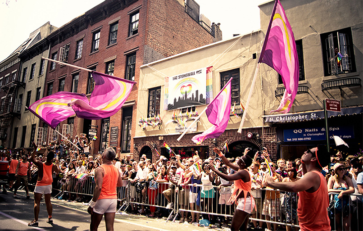 LGBTQ+ community marches in front of the landmarked Stonewall Inn