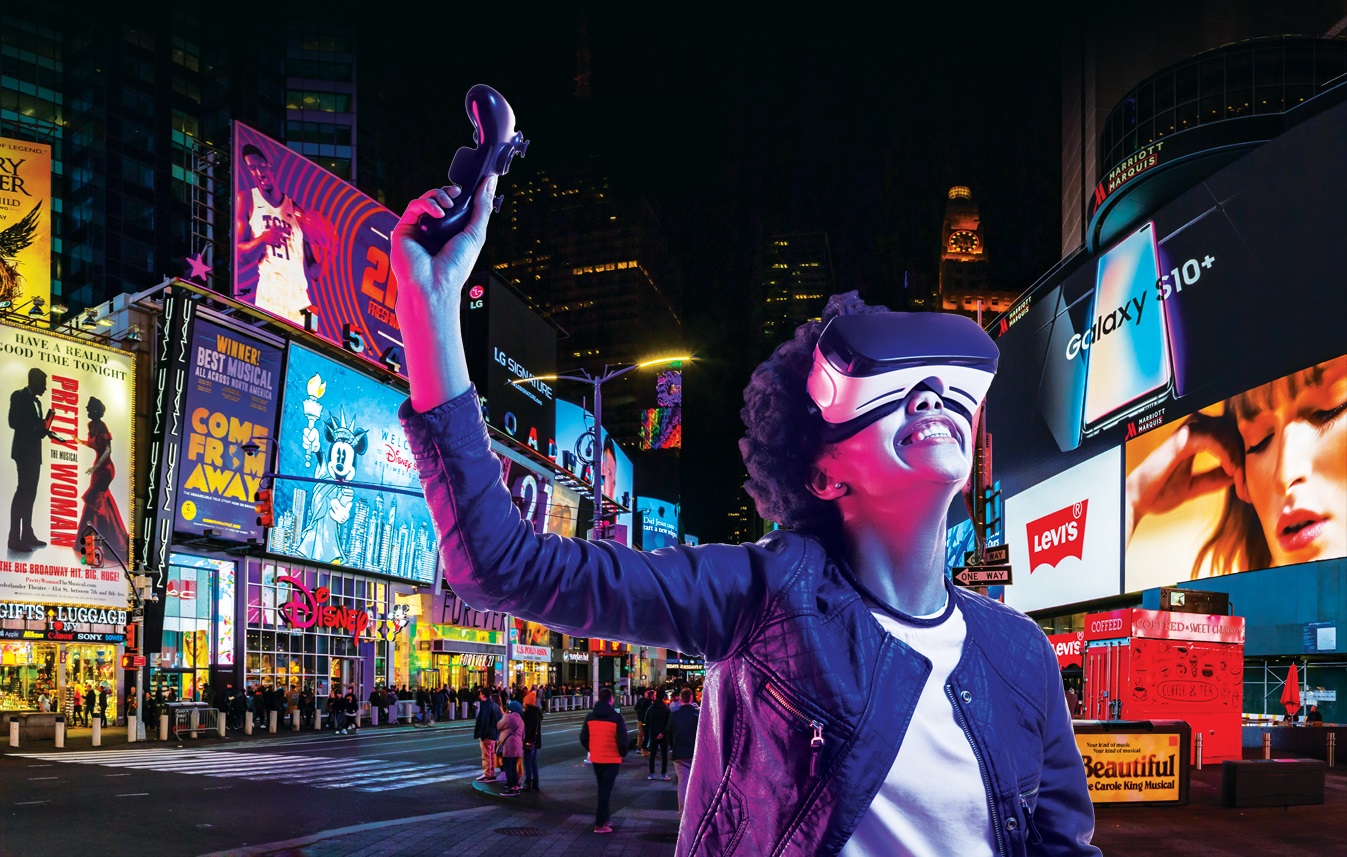 times square backdrop with buildings, plus woman wearing a vr headset
                                           