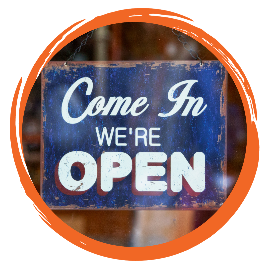Hanging sign with words that say Come in we're open