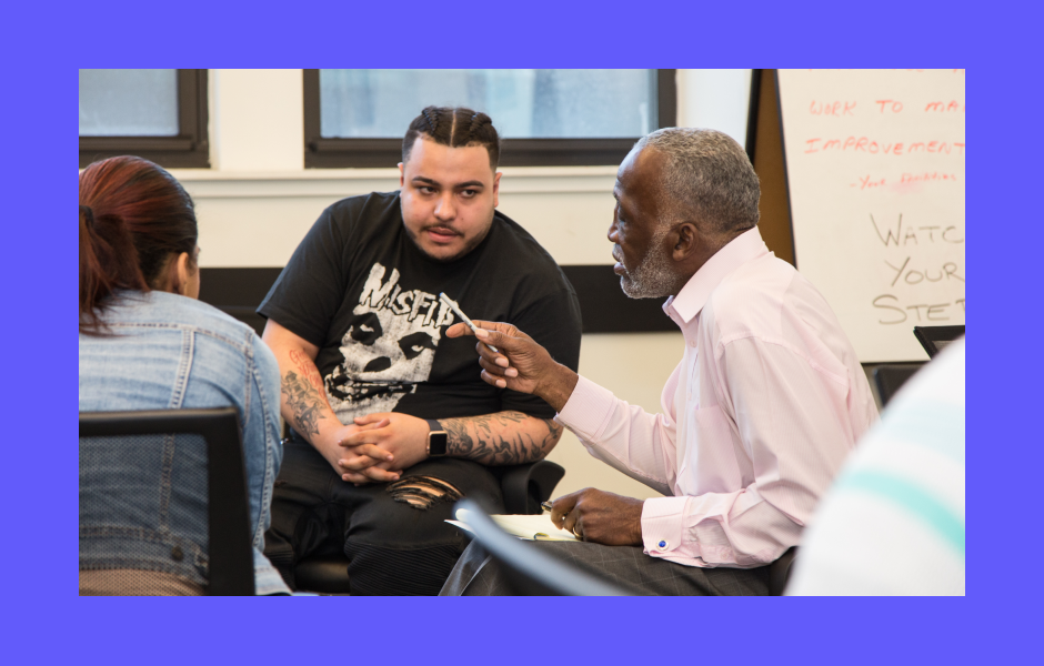Man mentoring a male participant in Arches Transformative Mentoring Program