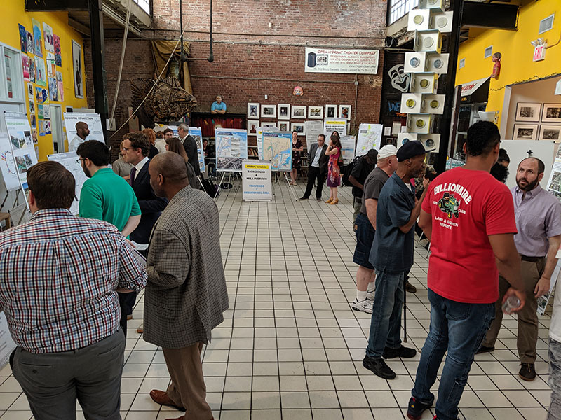 Members of the public discuss future service and their vision for Hunts Point during a public event at The Point.