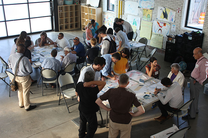 In the Rockaways, participants at a workshop creating their flood resilient building design