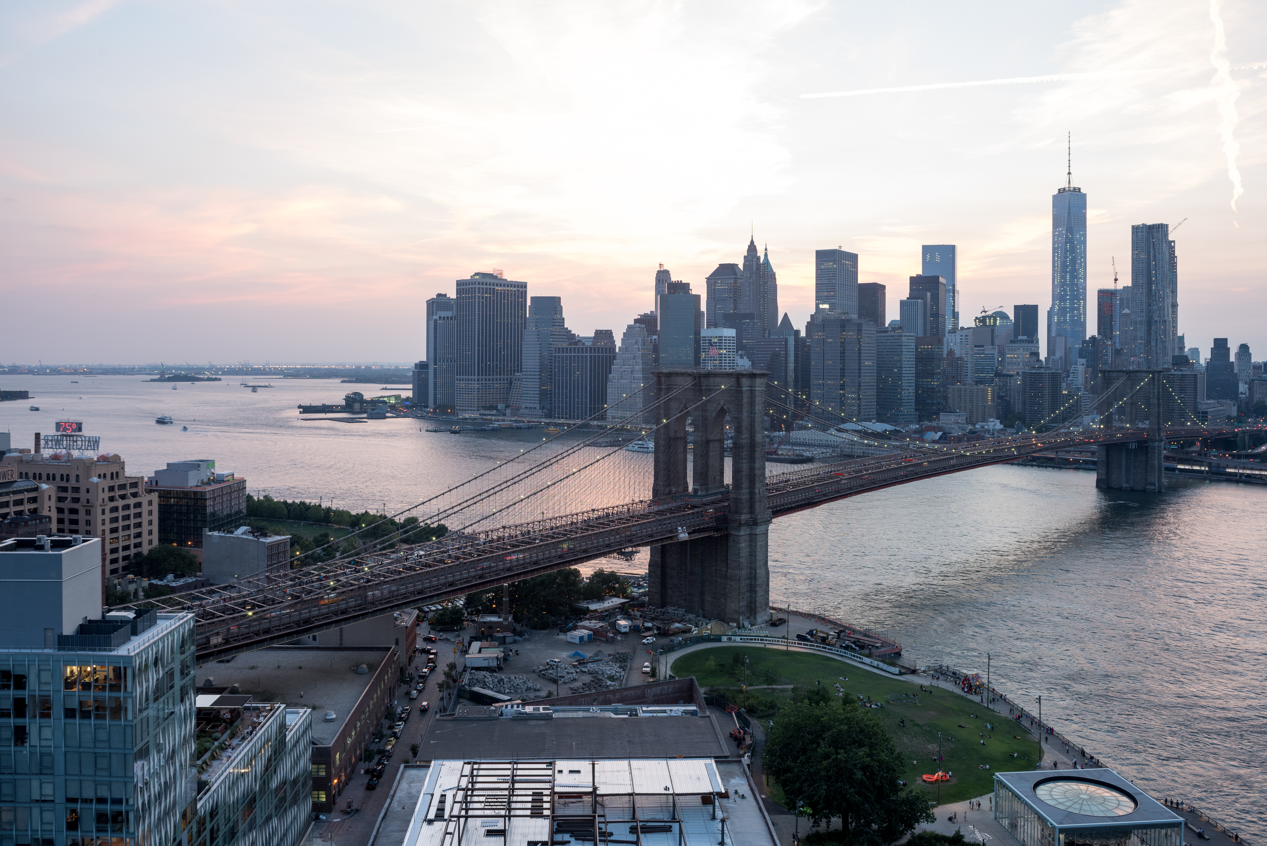Sunset view of Brooklyn Bridge and New York City
