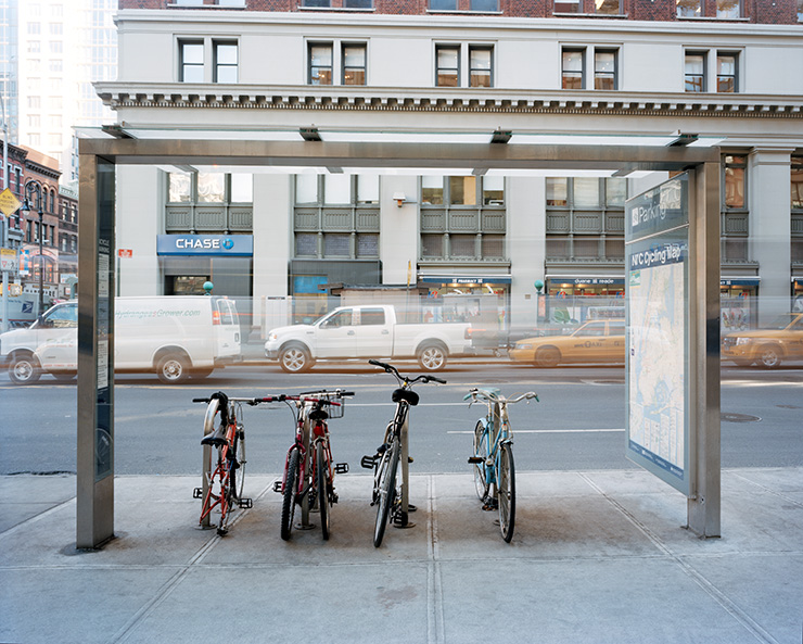 Bicycle parking shelter with bikes attached to the racks