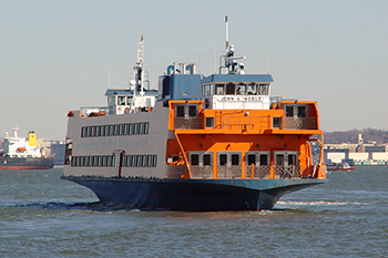 An orange Staten Island Ferry in the New York Harbor.