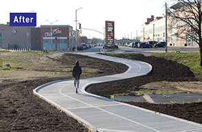 A pedestrian walks along a new concrete sidewalk that winds through a grassy area. 